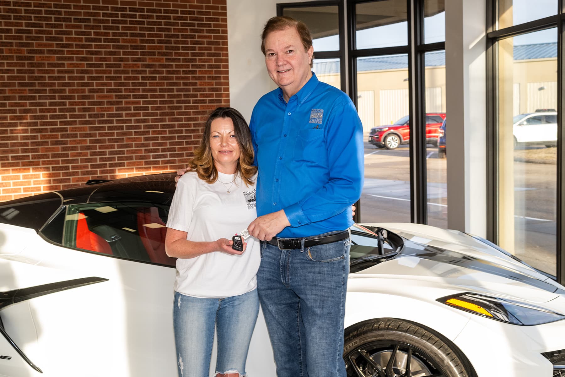 Previous sweepstakes winner Erica with the awarded Corvette